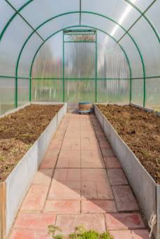 Greenhouse floor with brick pavers