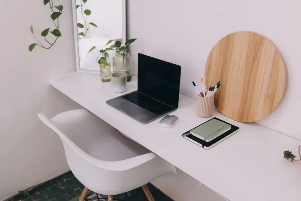 Dorm room with plants and laptop